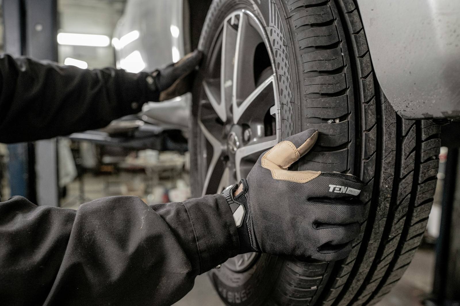 Technician fitting a wheel