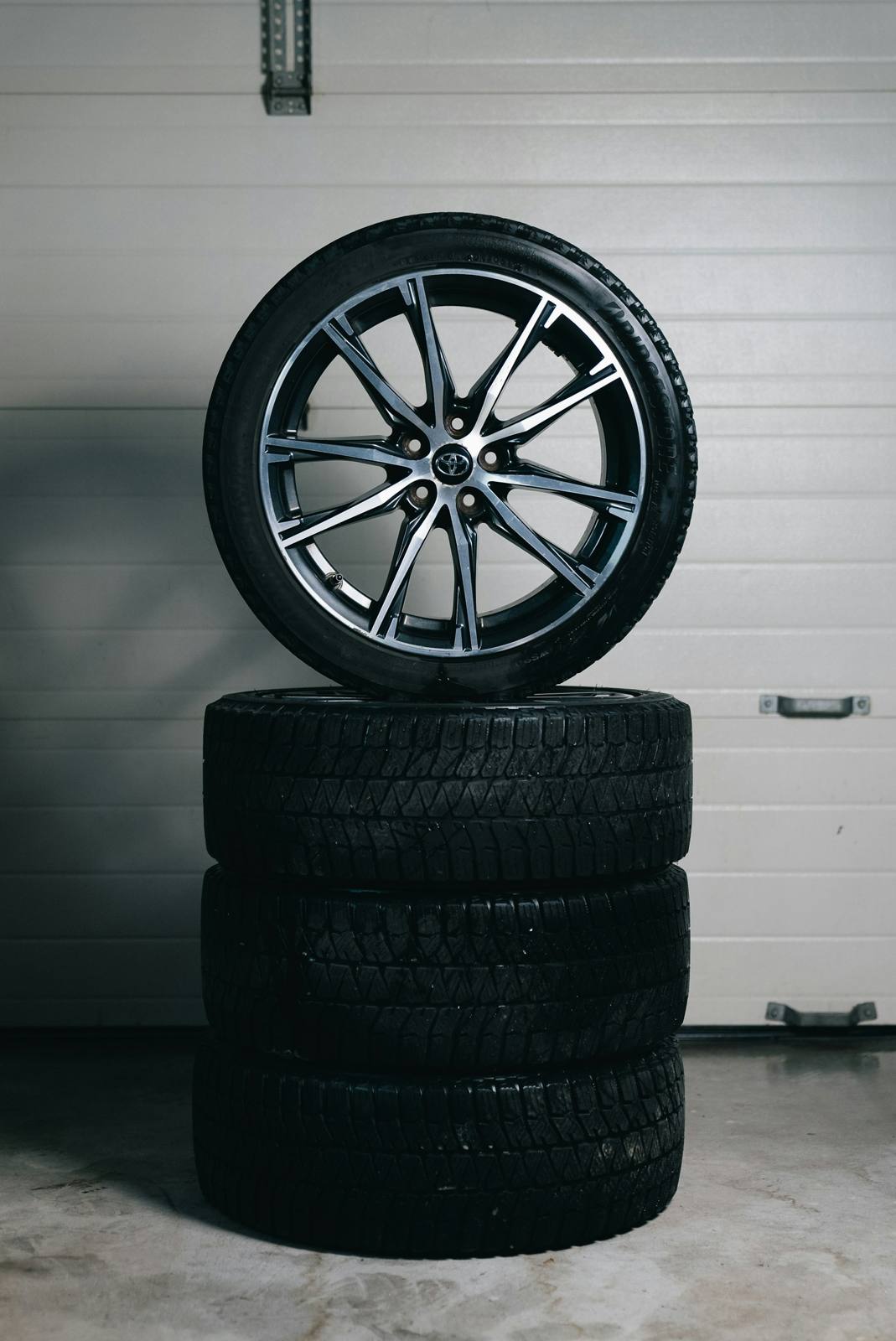 Alloy wheel on a stack of tires
